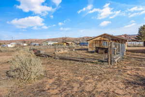 View of yard with a mountain view and an outbuilding