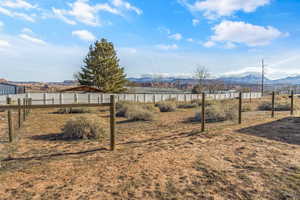 View of yard featuring a mountain view and a rural view