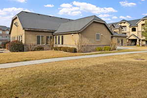 View of front of property with a front lawn