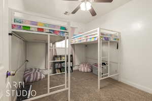 Bedroom featuring ceiling fan and carpet floors