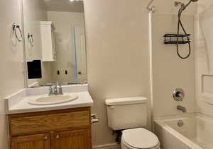 Full bathroom with toilet, vanity, and bathing tub / shower combination