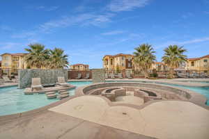 View of pool featuring a jacuzzi