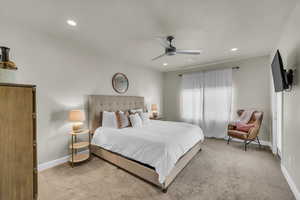 Carpeted bedroom featuring ceiling fan