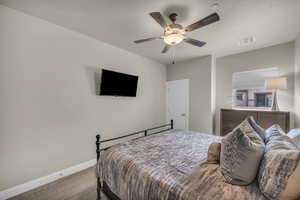 Bedroom with carpet flooring and ceiling fan