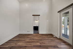 Primary bedroom with walk out french doors to the deck.