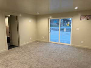 Empty room featuring carpet floors