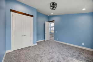 2nd  bedroom with carpet flooring, a closet, and recessed lighting