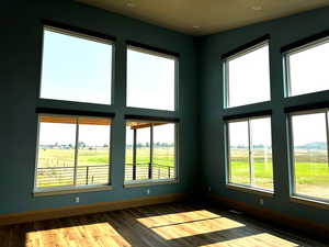 Spare room with a rural view and hardwood / wood-style flooring