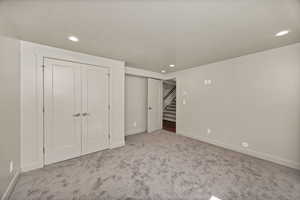 Bedroom 5 featuring carpet flooring, a closet, and recessed lighting