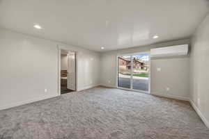 Bedroom 4  with carpet, recessed lighting, and sliding door to patio.