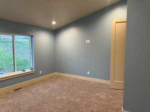 Empty room featuring carpet flooring