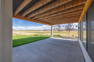 View of patio / terrace with a view of countryside and a mountain view