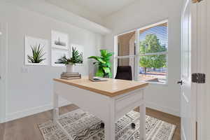 Office featuring light hardwood / wood-style flooring. Virtually staged