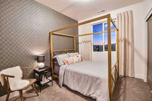 Pics are of model home.Bedroom featuring carpet floors