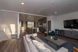 Pics are of model home.Living room with dark hardwood / wood-style floors