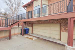 Back of property featuring a garage