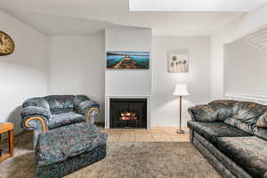 Living room with light tile patterned floors