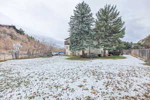 Snowy yard with a mountain view