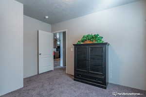 Unfurnished bedroom featuring carpet flooring