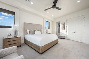 Carpeted bedroom with ceiling fan