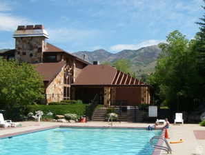 View of swimming pool featuring a patio area and a mountain view