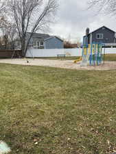 View of yard featuring a playground