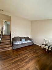 Sitting room featuring dark hardwood / wood-style flooring