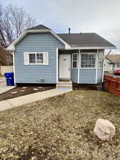 View of front of home featuring a front lawn