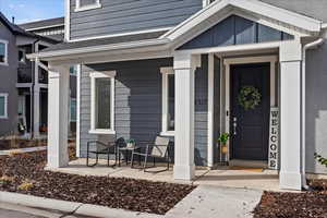 Property entrance featuring covered porch