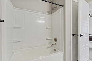 Bathroom featuring shower / bathtub combination