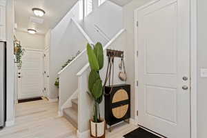 Entryway with light hardwood / wood-style floors