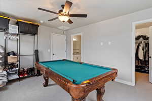 Playroom featuring a ceiling fan, carpet flooring, and pool table