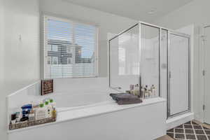 Bathroom featuring separate shower and tub