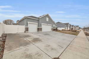 View of side of home with RV/Boat Parking