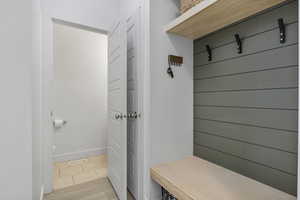 Mudroom with light hardwood / wood-style flooring