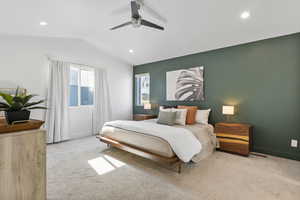 Bedroom with ceiling fan, light carpet, and vaulted ceiling