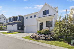 View of front facade featuring a garage