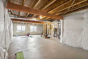 Basement featuring heating unit