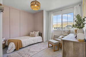 Bedroom with light colored carpet