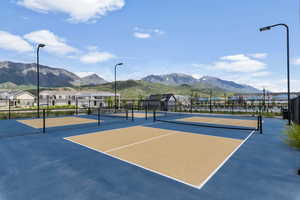 View of sport court featuring a mountain view and basketball court