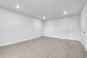 Empty room with carpet flooring