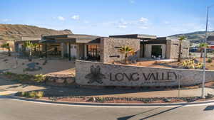 Community sign with a mountain view