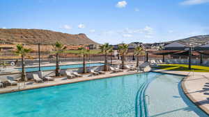 View of swimming pool featuring a mountain view and a patio area