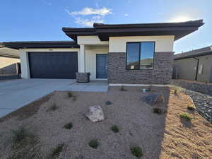 View of front of property featuring a garage