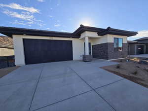 Prairie-style home with a garage