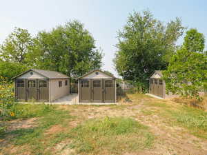 View of yard with a storage unit