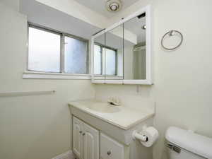 Bathroom featuring vanity and toilet