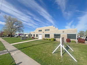 View of front of property featuring a front yard