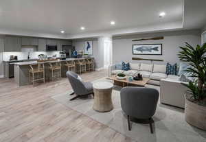 Living room featuring light hardwood / wood-style floors and sink