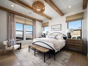 Bedroom with wood ceiling, a mountain view, wood-type flooring, and beam ceiling